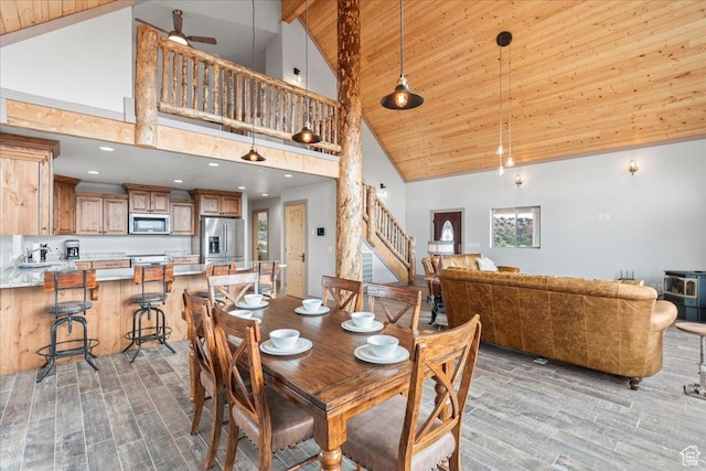 46982 W Thunder Ridge Rd, Fruitland, UT 84027 - dining space with high vaulted ceiling, wood finish floors, stairway, wooden ceiling with exposed beams, and recessed lighting