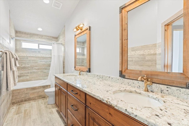 46982 W Thunder Ridge Rd, Fruitland, UT 84027 - bathroom featuring wood finished floors, toilet, tiled shower / bath combo, double vanity, and recessed lighting