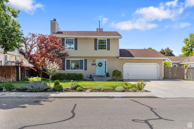 1064 E 200 N, Orem, UT 84097 - colonial home with a garage, a chimney, and driveway