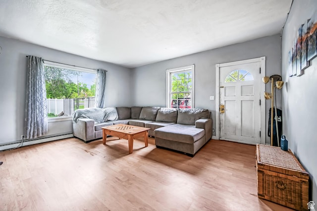 201 S 400 W, Logan, UT 84321 - living area with light wood-style floors and baseboard heating