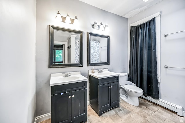 201 S 400 W, Logan, UT 84321 - full bathroom with a baseboard radiator and two vanities