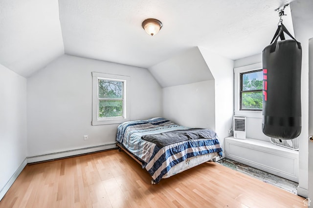 201 S 400 W, Logan, UT 84321 - bedroom with a baseboard radiator, lofted ceiling, and wood finished floors