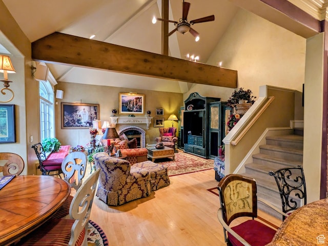 6331 S Shenandoah Ave, Salt Lake City, UT 84121 - living area with wood finished floors, ceiling fan, a fireplace, and stairs