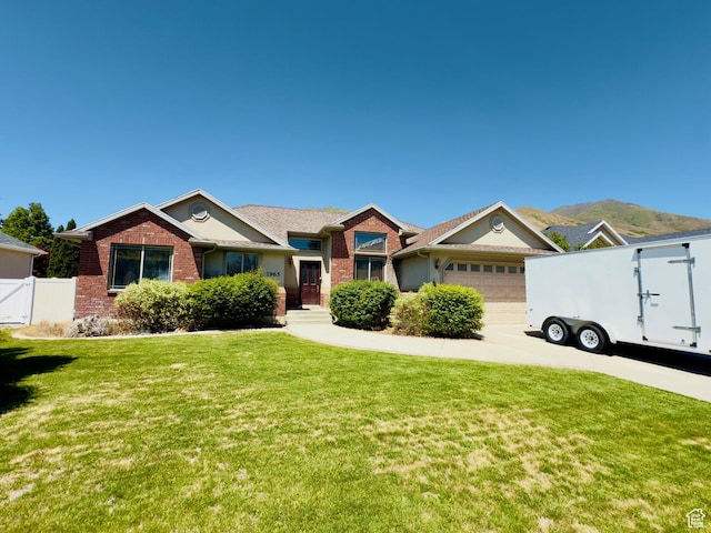 1965 E River Bottom Rd S, Springville, UT 84663 - ranch-style home with brick siding, a garage, driveway, and a gate