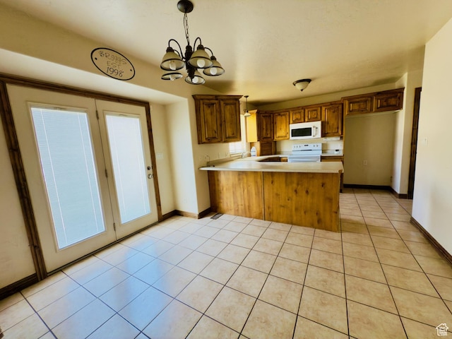 1965 E River Bottom Rd S, Springville, UT 84663 - kitchen featuring white appliances, a peninsula, light countertops, a chandelier, and light tile patterned floors
