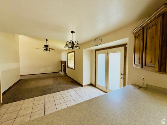 1965 E River Bottom Rd S, Springville, UT 84663 - spare room featuring light colored carpet, a chandelier, light tile patterned floors, a ceiling fan, and baseboards
