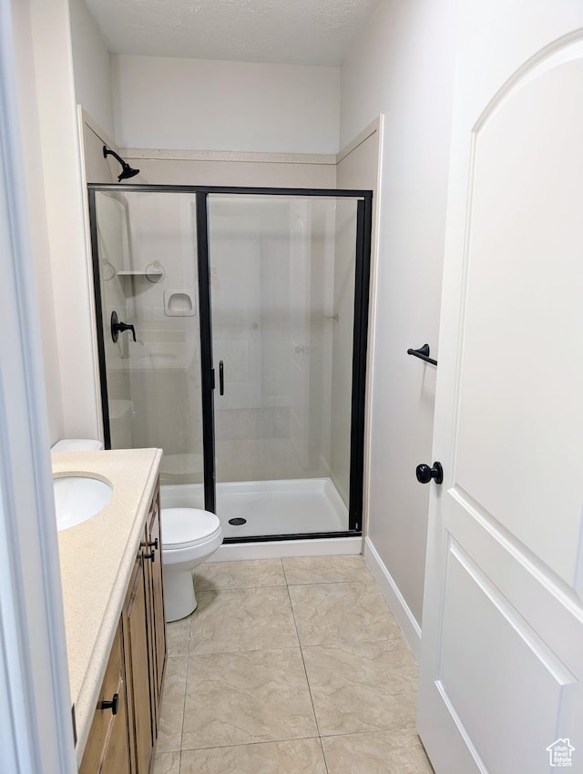 1030 N 995 W Unit 907, Orem, UT 84057 - bathroom with a shower stall, marble look tiles, vanity, and toilet