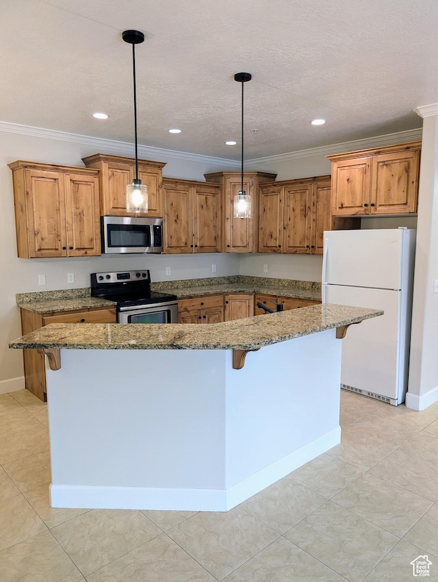 1030 N 995 W Unit 907, Orem, UT 84057 - kitchen with stainless steel appliances, a breakfast bar area, brown cabinets, crown molding, and stone countertops
