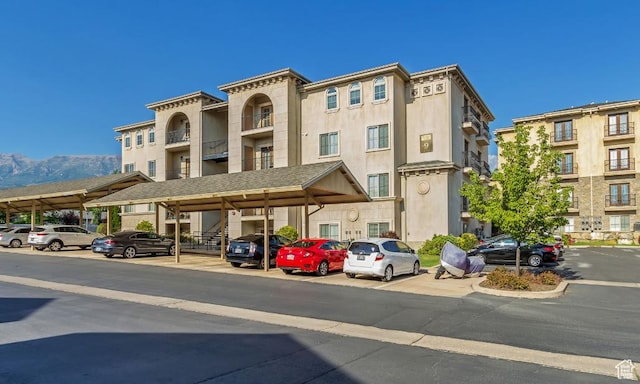 1030 N 995 W Unit 907, Orem, UT 84057 - view of property with covered and uncovered parking and a mountain view