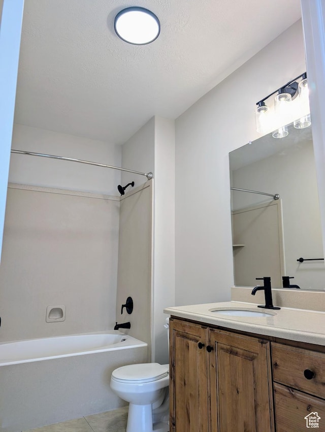 1030 N 995 W Unit 907, Orem, UT 84057 - full bath with toilet, vanity, tub / shower combination, a textured ceiling, and tile patterned flooring