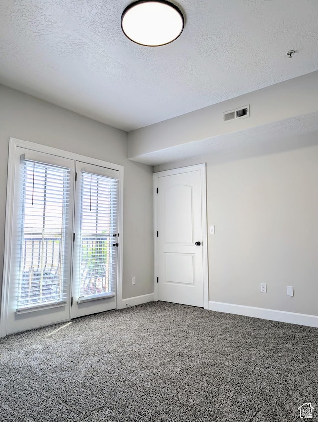 1030 N 995 W Unit 907, Orem, UT 84057 - empty room featuring a textured ceiling, carpet flooring, baseboards, and fire sprinkler in ceiling