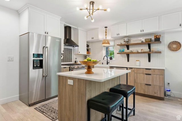 1411 S Utah St Unit 7, Salt Lake City, UT 84104 - kitchen with stainless steel appliances, wall chimney exhaust hood, open shelves, tasteful backsplash, and light wood-style flooring