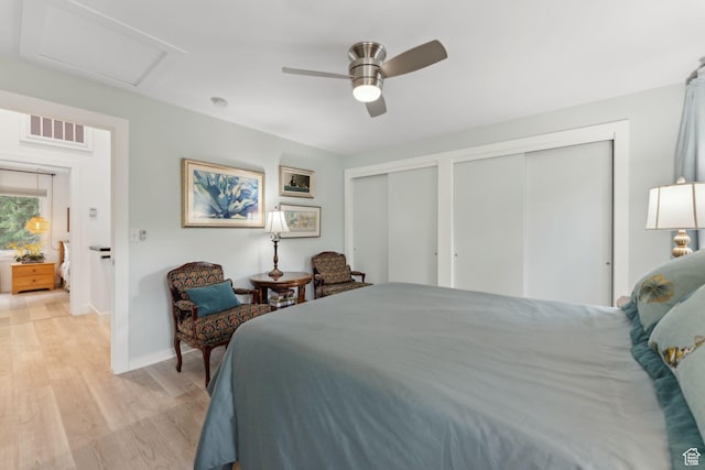 1411 S Utah St Unit 7, Salt Lake City, UT 84104 - bedroom featuring multiple closets, light wood-style floors, baseboards, attic access, and a ceiling fan