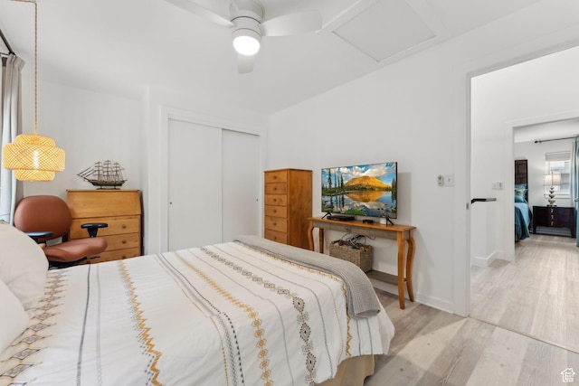 1411 S Utah St Unit 7, Salt Lake City, UT 84104 - bedroom with attic access, wood finished floors, a closet, a ceiling fan, and baseboards