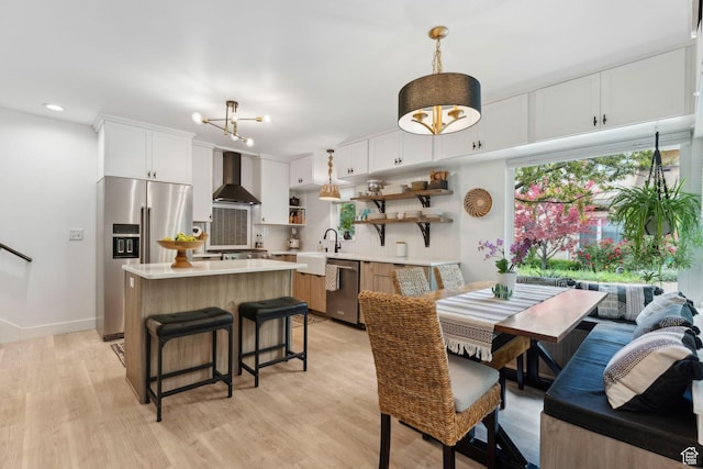 1411 S Utah St Unit 7, Salt Lake City, UT 84104 - dining area with light wood-style flooring, a chandelier, recessed lighting, and baseboards
