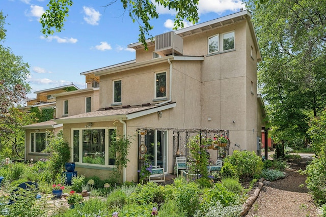 1411 S Utah St Unit 7, Salt Lake City, UT 84104 - rear view of property with stucco siding and central AC unit