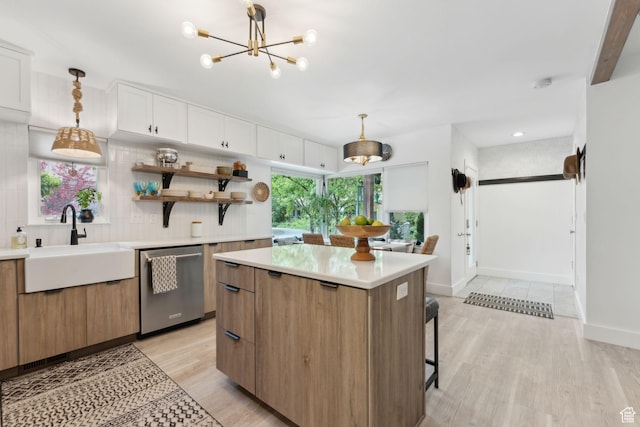 1411 S Utah St Unit 7, Salt Lake City, UT 84104 - kitchen with stainless steel dishwasher, a sink, light wood finished floors, and light countertops