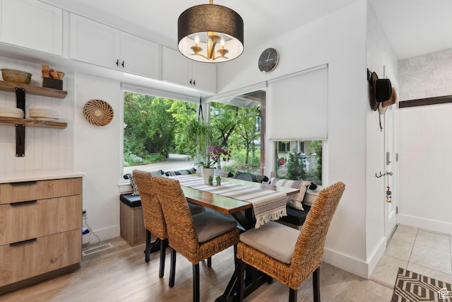1411 S Utah St Unit 7, Salt Lake City, UT 84104 - dining area with baseboards, a chandelier, and light wood-style flooring