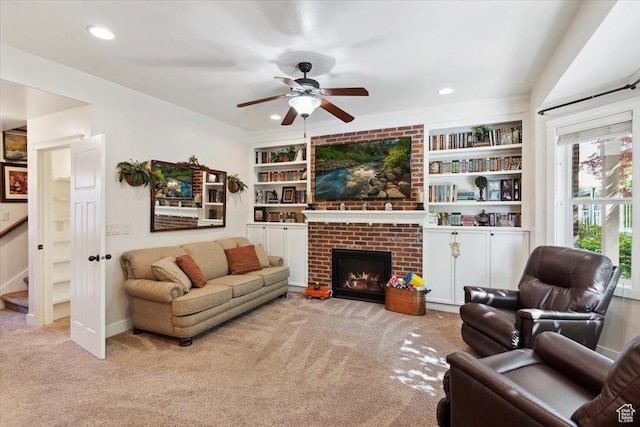 255 W 2700 N Unit 31, Pleasant View, UT 84414 - carpeted living room featuring a ceiling fan, a brick fireplace, built in shelves, recessed lighting, and stairway