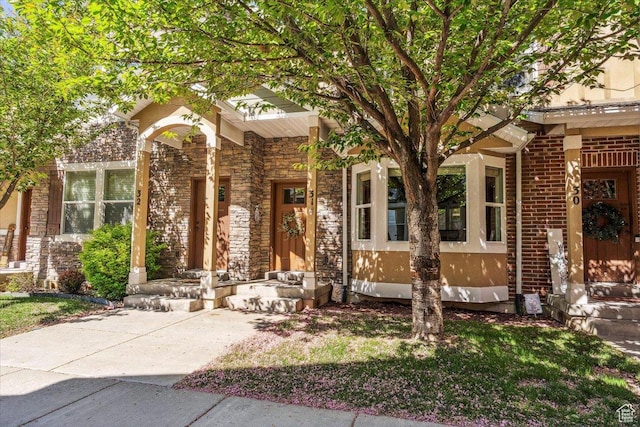 255 W 2700 N Unit 31, Pleasant View, UT 84414 - view of front of house featuring a porch and stone siding