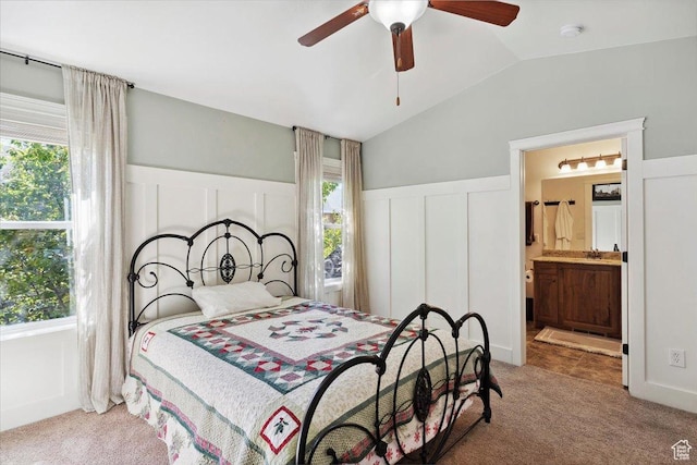 255 W 2700 N Unit 31, Pleasant View, UT 84414 - bedroom featuring carpet, vaulted ceiling, wainscoting, a decorative wall, and ensuite bath
