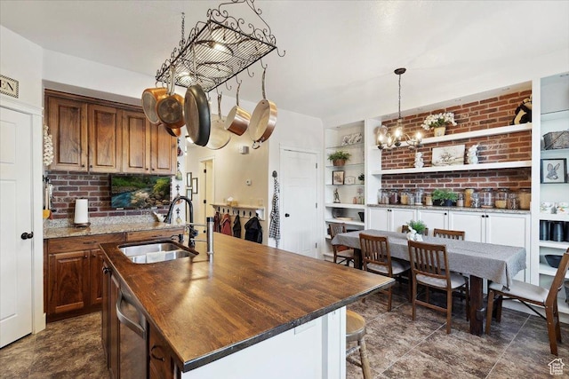 255 W 2700 N Unit 31, Pleasant View, UT 84414 - kitchen featuring a sink, stainless steel dishwasher, an island with sink, open shelves, and a breakfast bar