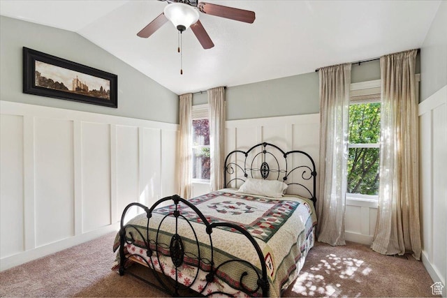 255 W 2700 N Unit 31, Pleasant View, UT 84414 - carpeted bedroom with a decorative wall, vaulted ceiling, wainscoting, and a ceiling fan