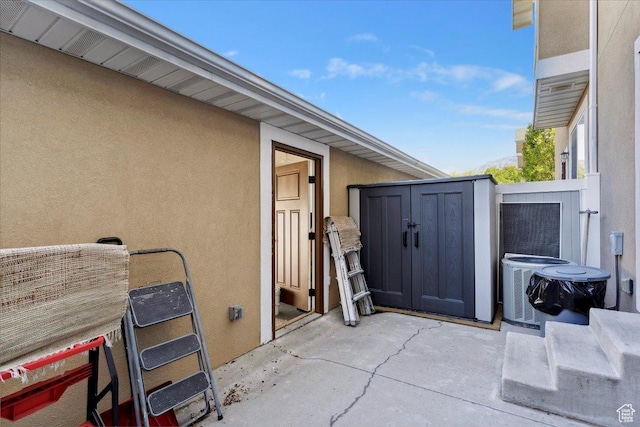 255 W 2700 N Unit 31, Pleasant View, UT 84414 - view of patio featuring central AC unit