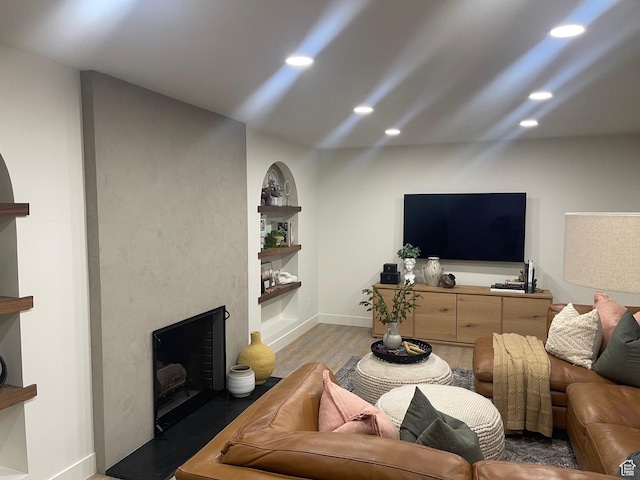 1136 E 3580 S, Millcreek, UT 84106 - living room with a high end fireplace, light wood-style flooring, recessed lighting, and baseboards