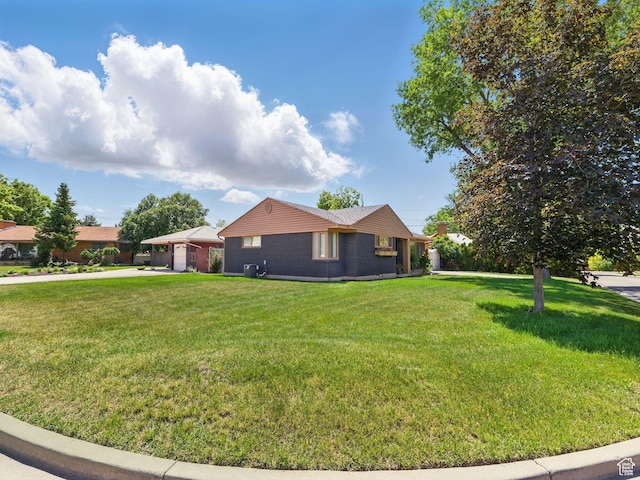 1136 E 3580 S, Millcreek, UT 84106 - view of side of property with driveway, a yard, brick siding, and a garage
