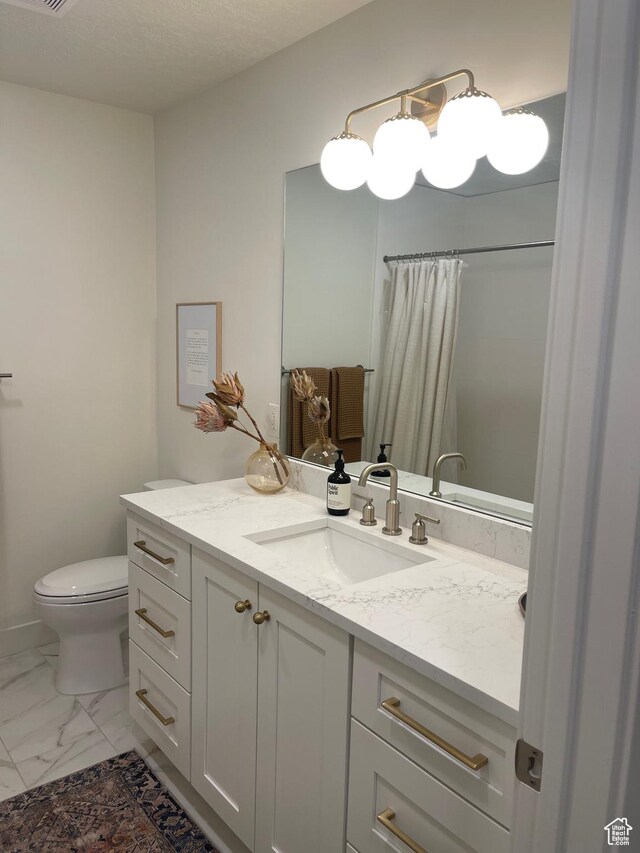 1136 E 3580 S, Millcreek, UT 84106 - bathroom with vanity, marble look tiles, toilet, and a shower with shower curtain