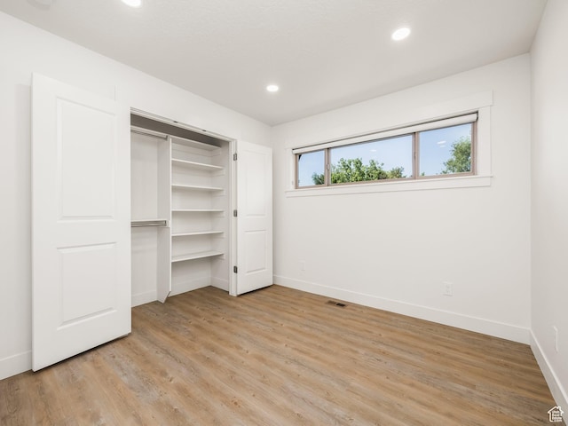 1136 E 3580 S, Millcreek, UT 84106 - unfurnished bedroom featuring baseboards, light wood-style flooring, recessed lighting, and a closet