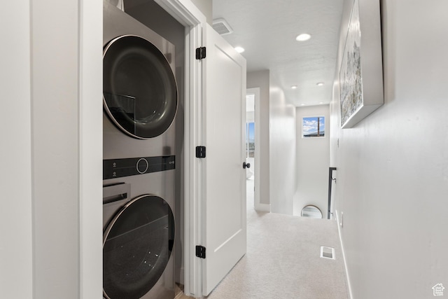 6625 Mountain Alder Way Unit 24, Park City, UT 84098 - laundry area with stacked washing machine and dryer, carpet flooring, and recessed lighting