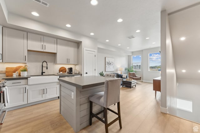 6625 Mountain Alder Way Unit 24, Park City, UT 84098 - kitchen featuring a sink, a center island, light wood finished floors, open floor plan, and recessed lighting