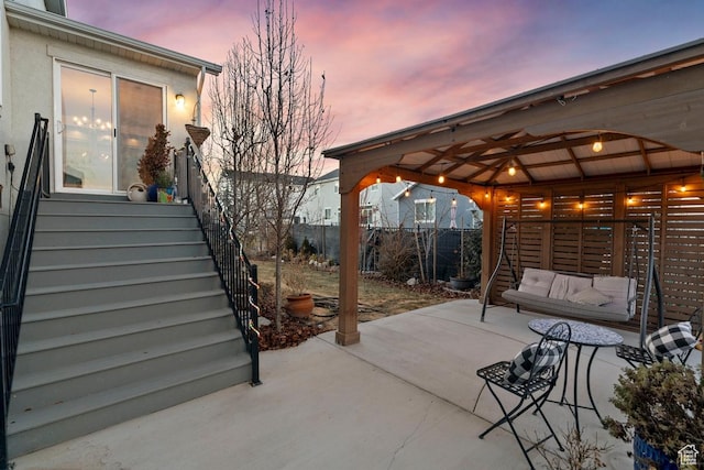 144 E Shorewood Dr S, Saratoga Springs, UT 84045 - patio terrace at dusk with a patio area, a gazebo, and stairway