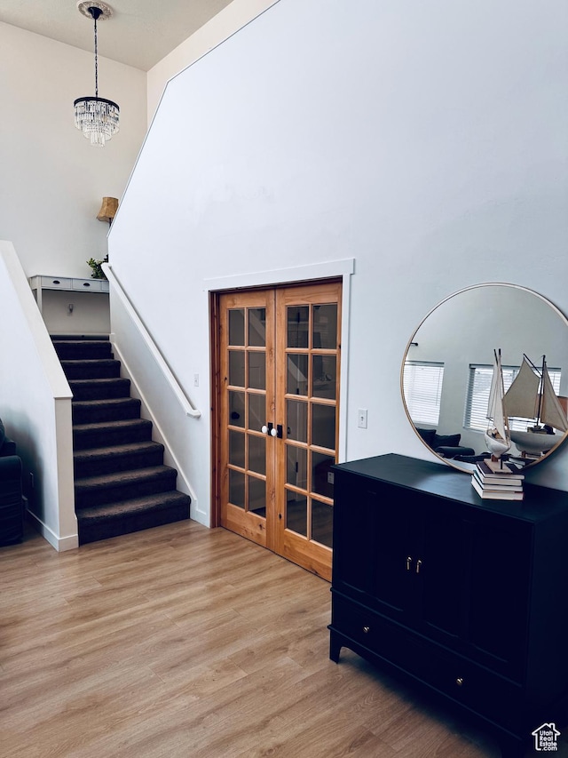 144 E Shorewood Dr S, Saratoga Springs, UT 84045 - interior space featuring french doors, wood finished floors, a chandelier, and baseboards