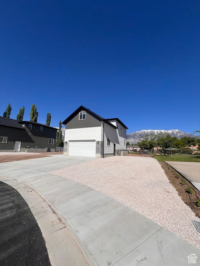 502 N 450 W, Orem, UT 84057 - view of front of home featuring a mountain view, driveway, and an attached garage