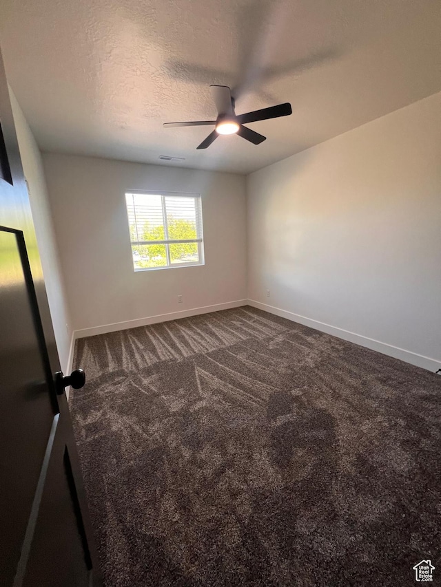 502 N 450 W, Orem, UT 84057 - unfurnished room featuring dark colored carpet, a ceiling fan, baseboards, and a textured ceiling