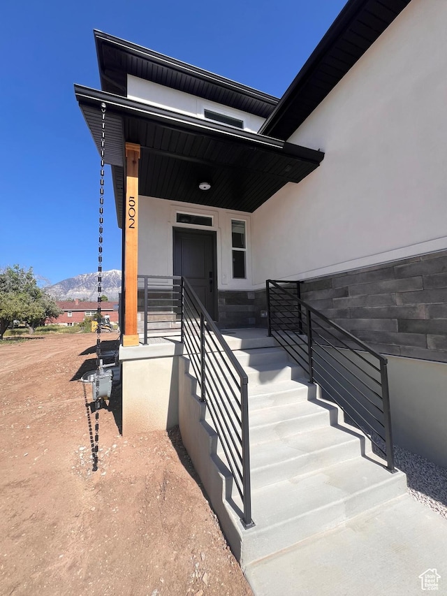 502 N 450 W, Orem, UT 84057 - view of exterior entry with a mountain view, stucco siding, and a porch