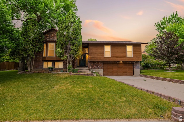 586 W 4000 S, Riverdale, UT 84405 - view of front of house with a garage and driveway