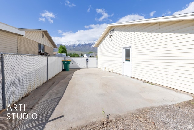 950 E 120 S, Orem, UT 84097 - view of property exterior with a mountain view, a patio, and a gate