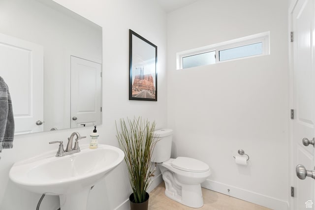 5670 S Carnelian Pkwy S, Bloomington, UT 84790 - bathroom featuring toilet, baseboards, and a sink
