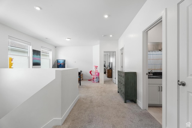 5670 S Carnelian Pkwy S, Bloomington, UT 84790 - corridor with an upstairs landing, light carpet, a sink, recessed lighting, and baseboards