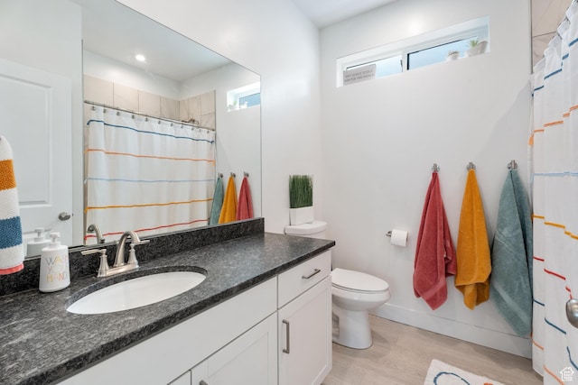 5670 S Carnelian Pkwy S, Bloomington, UT 84790 - full bathroom featuring vanity, toilet, wood finished floors, a shower with curtain, and baseboards