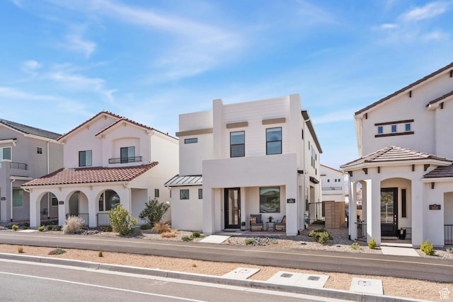 5670 S Carnelian Pkwy S, Bloomington, UT 84790 - view of front facade featuring stucco siding and a porch