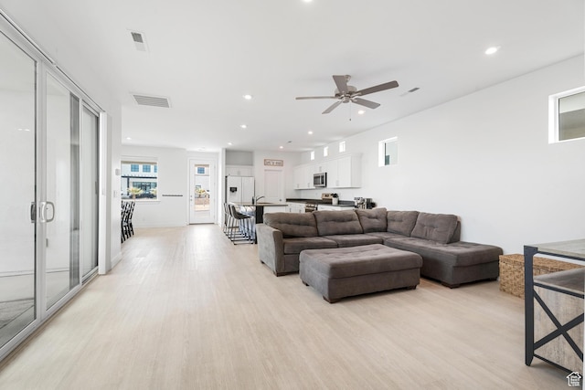 5670 S Carnelian Pkwy S, Bloomington, UT 84790 - living room featuring light wood-style flooring, a ceiling fan, and recessed lighting