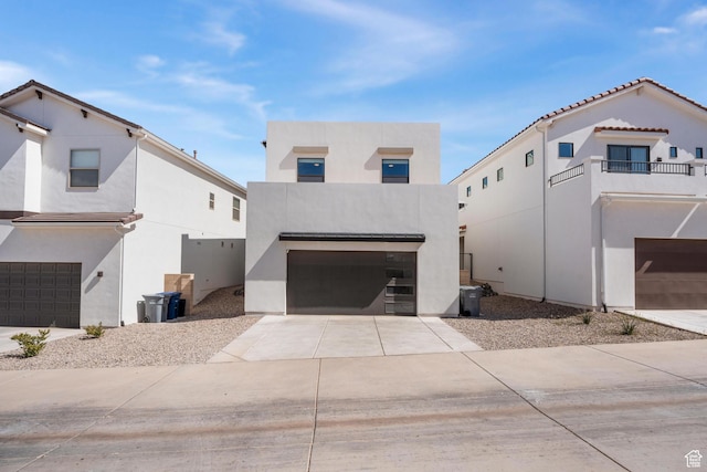 5670 S Carnelian Pkwy S, Bloomington, UT 84790 - view of front facade featuring an attached garage, stucco siding, and concrete driveway