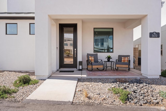 5670 S Carnelian Pkwy S, Bloomington, UT 84790 - entrance to property with a porch and stucco siding