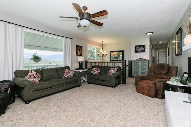 3704 S State St, Preston, ID 83263 - living area featuring carpet flooring, a chandelier, and a ceiling fan