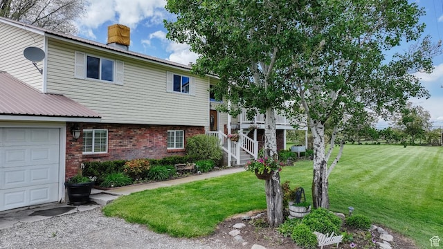 3704 S State St, Preston, ID 83263 - view of front of property featuring a chimney, a front lawn, brick siding, and stairs